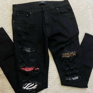 Amiri Distressed patch jeans